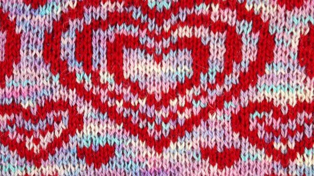 Knitted wool jocquard with hearts. Romantic background. Handmade