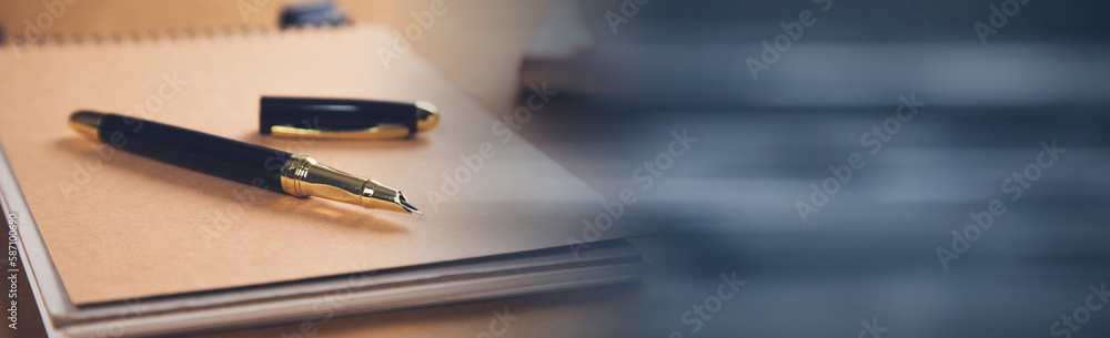 Poster pen on notepad with coffee on table