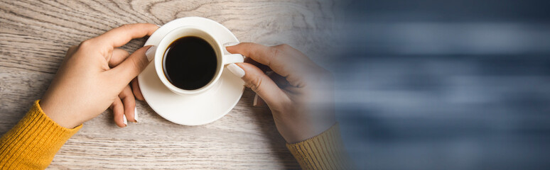woman holding cup of coffee