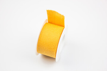 Plaster medical for wounds.Reel with a plaster on a white background. Yellow medical patch.