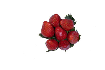 small pile of strawberries placed upright or upright with green leaves placed on a transparent background png with space for text