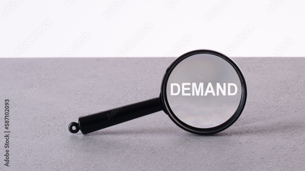 Poster magnifier focuses on the word demand. finding, detecting or focusing on a problem and analyzing for 