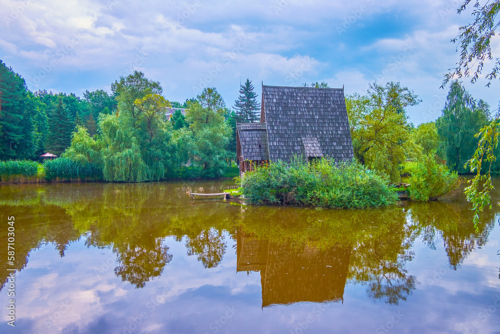 Poster The tiny wooden hunter's house in Styr hunting farm, Zbrui village, Lviv Region, Ukraine