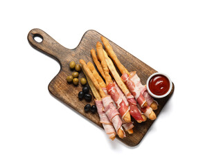 Wooden board of tasty Italian Grissini with bacon on white background