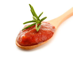 Spoon with tasty tomato paste on white background