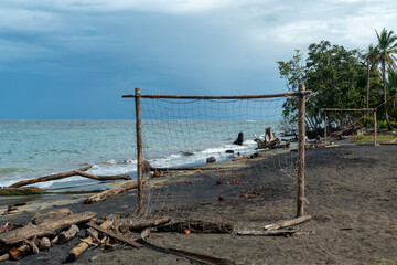 beach of Cocles on the Caribbean side of Costa Rica, Puerto Viejo de Talamanca with an handmade soccer coal made of palm trees