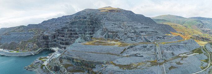 Wide panoramic aerial view of Llyn Peris Lake. View over slate quarry to lake and mountains,...