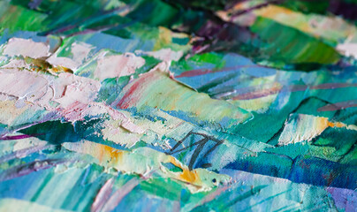 Abstract background of blue-green oil strokes close-up