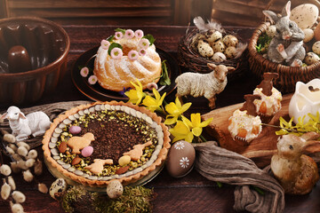 Fototapeta na wymiar Easter table in rustic style with traditional pastries and decors