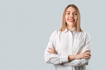 Female business consultant on grey background