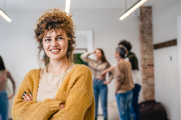 woman caucasian female in front of group of people happy smile at work