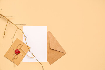 Composition with envelopes, blank card and tree branch on color background