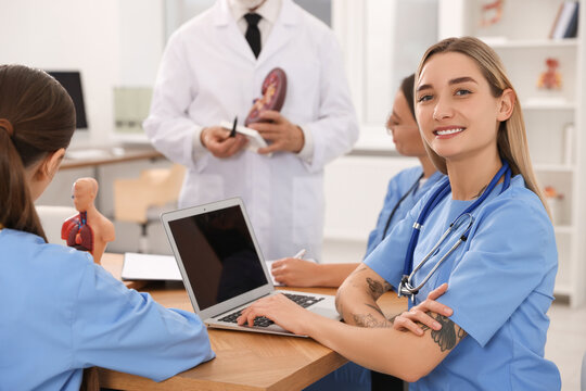 Portrait of young intern wearing uniform on lecture in university