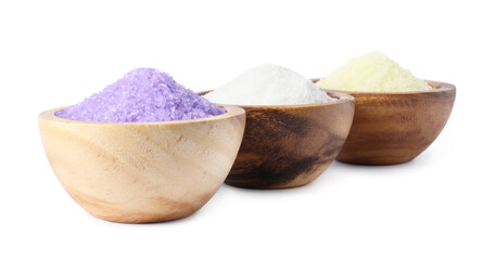 Wooden bowls with different sea salt on white background