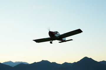 Fototapeta na wymiar Beautiful view of ultralight airplane in blue sky