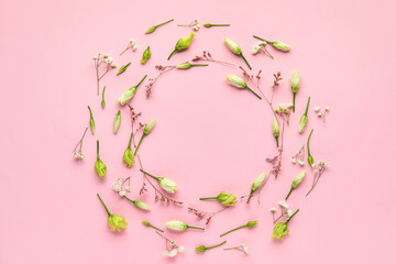 Frame made of beautiful flowers on pink background