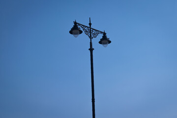 street lamp on blue sky. Modern street light isolated 