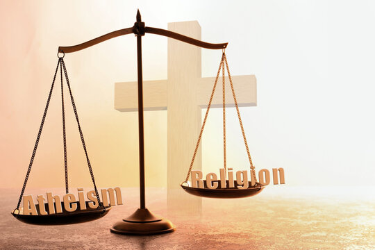 Choice between atheism and religion. Scales with words on textured surface against cross