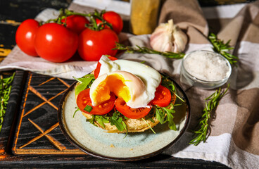 Plate with tasty egg Benedict on table