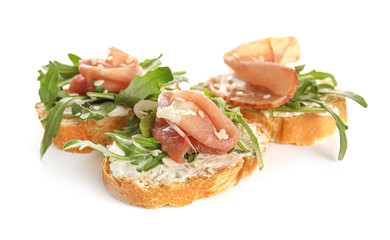 Tasty jamon bruschettas with arugula on white background