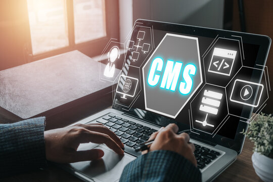CMS, Content management system concept, Person hand using laptop computer with Content management system icon on virtual screen background, business web computer website administration.