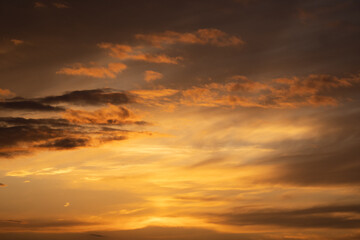 Fototapeta na wymiar Golden sunset clouds