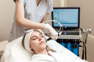 Face Skin Care. Woman Getting Facial Hydro Microdermabrasion Peeling Treatment