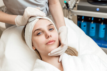 Fototapeta na wymiar Close-up Of Woman Getting Peeling Treatment At Cosmetic Beauty salon
