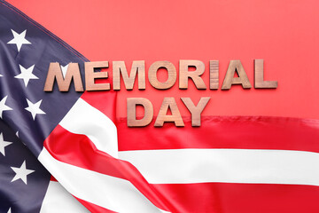 Text MEMORIAL DAY and USA flag on red background