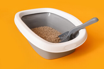 Litter box for cat on yellow background
