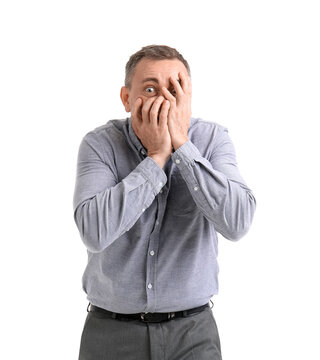 Scared mature man on white background
