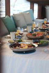 Dining table located on a cruise ship Tourist boats, seafood, drinks