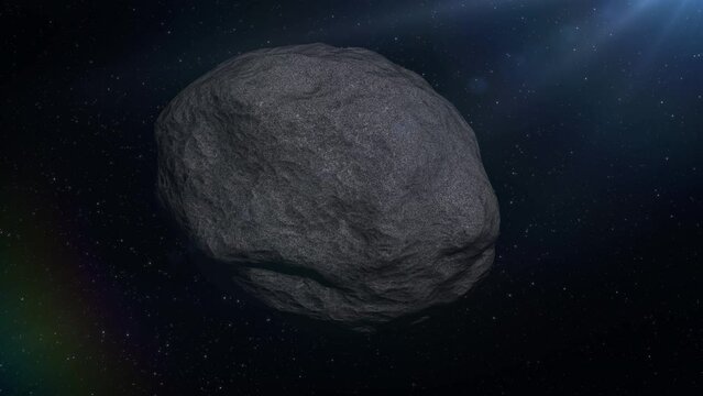 A 4K shot of a space rock or metallic asteroid drifting and tumbling through outter space.