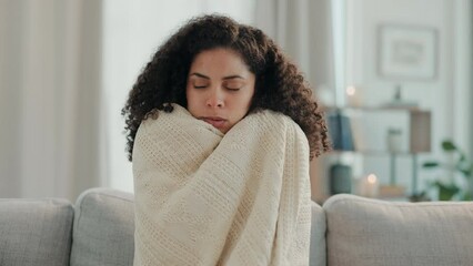 Cold, winter and woman with blanket on sofa for warmth, shivering virus and freezing weather. Sick girl, flu and freeze on couch with body hypothermia, medical illness and fever chills in living room - Powered by Adobe