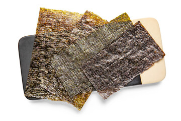 Board with natural nori sheets isolated on white background