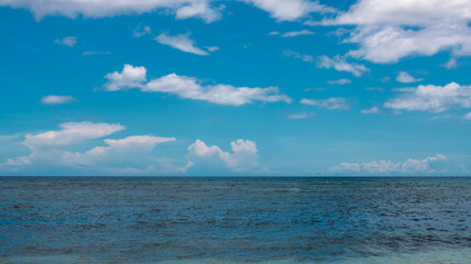 sea and sky in clouds, sunny day, horizon line, clear sea