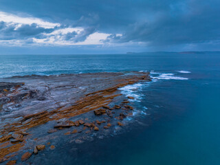 Rain cloud sunrise over the beach and mountain
