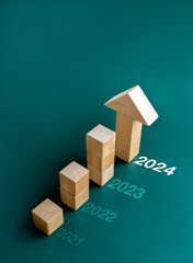 2024, 2023,2022 and 2021 new year calendar number and wooden cube blocks bar graph steps with big...
