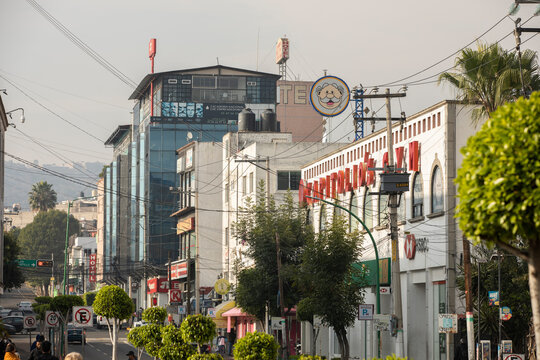 Ecatepec de Morelos, Mexico - November 19, 2022: Morning light shines on a busy downtown street of Ecatepec de Morelos.