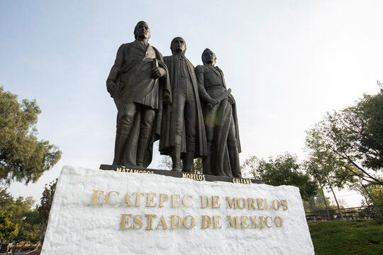 Ecatepec de Morelos, Mexico - November 19, 2022: Morning light shines on Statues of Mariano Matamoros, Jos&eacute; Mar&iacute;a Morelos and Hermenegildo Galeana in Ecatepec's main square.