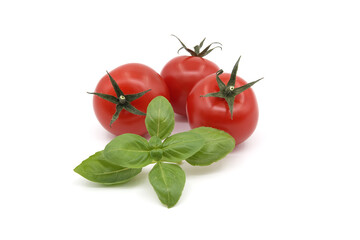 Fresh green basil leaves and cherry tomatoes isolated on white
