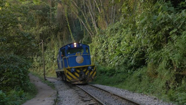 The famous train of Machu Picchu goes to Aguas Calientes in the tropical forest, Peru