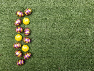 Chocolate Easter Eggs on Artificial Grass Background