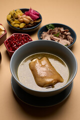 Traditional khash soup with snacks