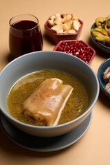 Traditional khash soup with snacks