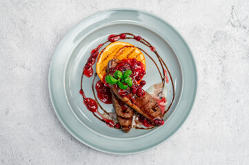 Tasty duck breast with orange and berries