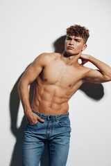 Fototapeta premium man attractive sport health white background muscular model strong chest bodybuilder torso muscle gray background