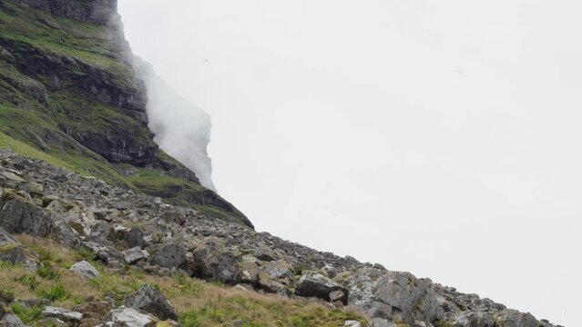 Fog On Rocky Mountain In Lovund In Nordland County, Norway. low angle