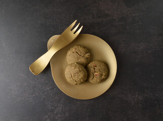 homemade Japanese western asian cookies with peanut, matcha, earl grey tea, almond green tea and icing sugar in round shape on black and gold luxury background handmade fresh bakery pastry halal menu