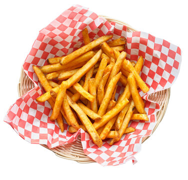 basket of seasoned french fries isolated on transparent background and shot top down